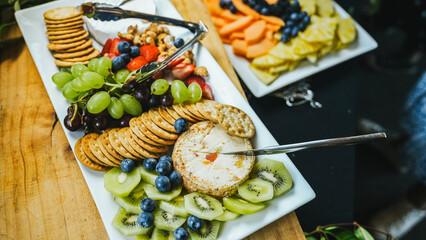 Vibrant fruit and biscuit platters ready for guests.