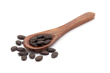 Front view of a wooden spoon filled with dry Organic Sponge Gourd (Luffa aegyptiaca) seeds. Isolated on a white background.