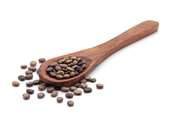 Front view of a wooden spoon filled with dry Organic cluster bean  (Cyamopsis tetragonoloba) seeds. Isolated on a white background.