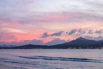 Beautiful sunrise on the sea, mountains on background, Spain, Mallorca