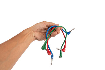 Black male hand holding colourful audio cables isolated cutout no background