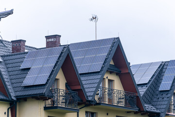 photovoltaic panels on a black metal roof tile