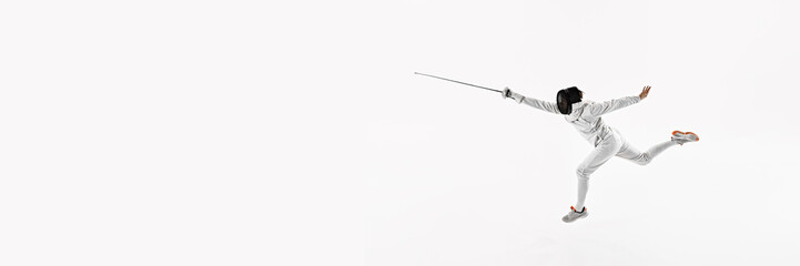 Banner. Fencer in white uniform lunges forward, holding rapier against white studio background with...