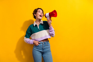 Photo of dreamy excited lady dressed polo shirt shouting bullhorn empty space isolated yellow color background