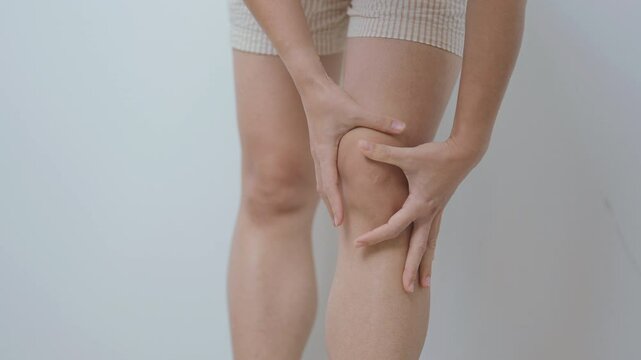woman having knee ache and muscle pain due to Runners Knee or Patellofemoral Pain Syndrome, osteoarthritis, arthritis, rheumatism and Patellar Tendinitis. medical concept