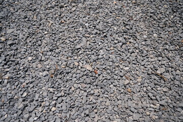 An intricate grayscale pattern of textured stone and concrete surfaces, depicting a blend of natural and industrial materials