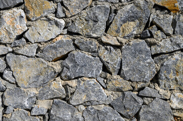 Old weathered stone wall of medieval fortress brick horizontal grunge background