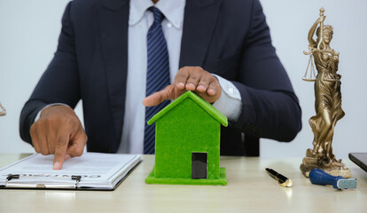 A lawyer advises a client on a property foreclosure settlement. They discuss the mortgage debt,...