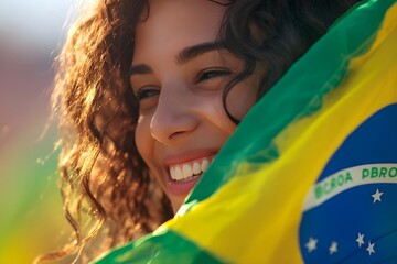 Happy young girl football fan celebrating her team victory. Latino woman with Brazil flag laughing and smiling. Celebration of Independence Day, Labor Day, Proclamation of the Republic