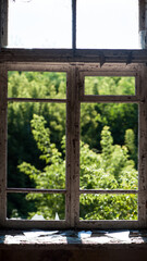 Smashed glass Window with old wooden frame. old window. finely broken glass. old house, retro....