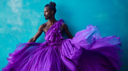 african male model in purple dress posing against blue background, high fashion portrait with bold colors and dramatic lighting