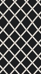 A black and white diamond pattern wallpaper with a geometric design
