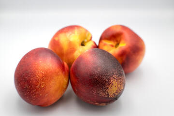 Nectarines, fresh sweet fruit with a seed inside.
