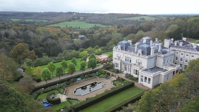 Beaverbrook Luxury Country House Hotel aerial reveal revealing shot from behind trees forest castle estate luxury resort golf club