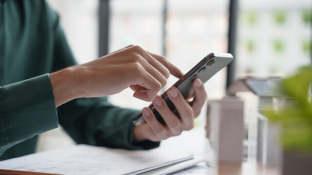 Architecture Man use smart phone for architectural Creative project business architecture ecosystem building construction Industrial engineering Design.