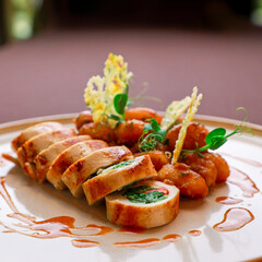 tasty chicken sushi with potatoes on white plate