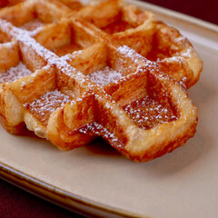 Homemade Belgian waffles on white plate