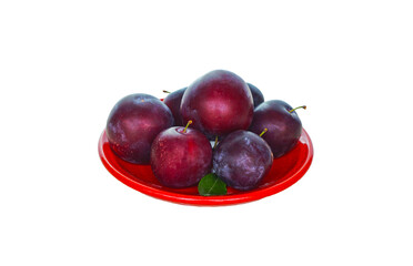 there are plums on the red tray