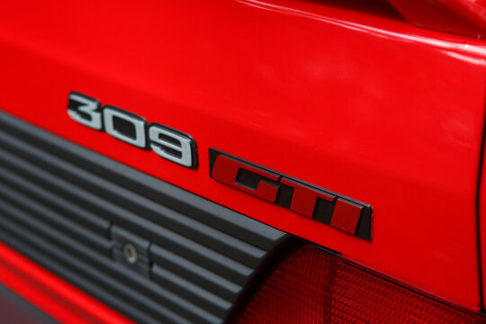 Classic red Peugeot 309 GTI during an open-air classic car exhibition