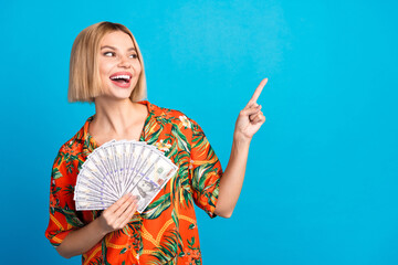 Fototapeta premium Photo of cheerful adorable lovely girl wear trendy summer print clothes look empty space isolated on blue color background