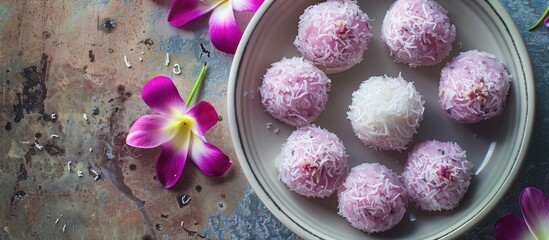 Naklejka premium Homemade sweets with coconut milk and taro ingredients perfect for a tropical treat with copy space image