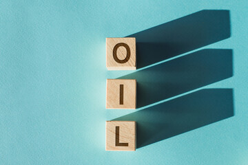 Oil symbol. A wooden cubes with up arrow. Wooden block with the concept word OIL