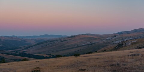 The sky is a beautiful mix of orange and pink hues, creating a serene and peaceful atmosphere