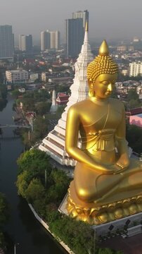 An aerial view of the Giant Buddha and Pagoda at Wat Paknam Phasi Charoen Temple in Bangkok, Thailand.