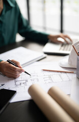 Interior architect working with blueprint planning in modern office, engineering concept