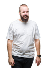 Fototapeta premium Young caucasian hipster man wearing casual t-shirt over isolated background winking looking at the camera with sexy expression, cheerful and happy face.