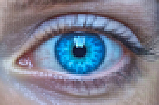 Digital picture of a woman's blue eyes, zoomed in, showing square pixels of the electronic image. Highly pixelated computer photo file. Concept on digital espionage, software embedded digital spyware.