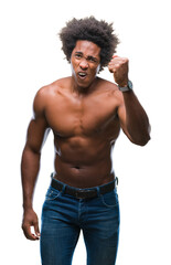 Afro american shirtless man showing nude body over isolated background angry and mad raising fist frustrated and furious while shouting with anger. Rage and aggressive concept.