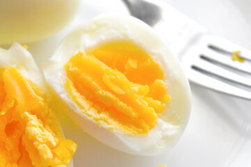 ฺBoiled egg on a white plate. Healthy and dietary food.
