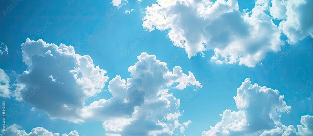 Poster A scenic view of the expansive blue sky with fluffy clouds ideal for a copy space image