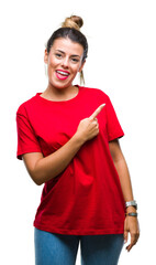 Fototapeta premium Young beautiful woman over isolated background cheerful with a smile of face pointing with hand and finger up to the side with happy and natural expression on face looking at the camera.