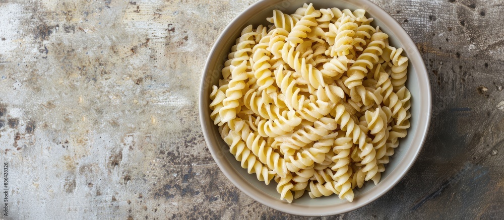 Aufkleber top view of a small bowl filled with creamy peanut pasta placed on a table background with copy spac