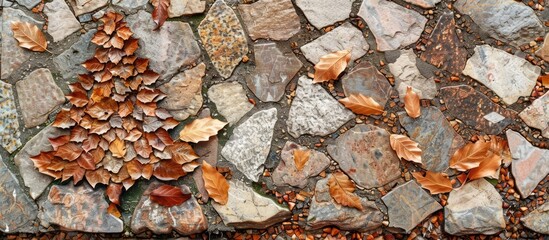 Leaves in the shape of a Christmas tree descended onto the mosaic ground revealing copy space image
