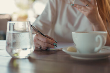 woman in cafe working or studying
