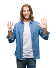 Young handsome man with long hair over isolated background showing and pointing up with fingers...