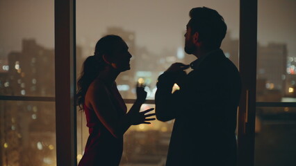 Married couple silhouettes quarrelling panoramic flat closeup. Sad woman crying