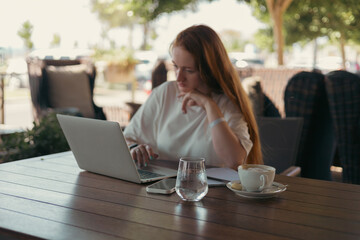 woman in cafe working or studying