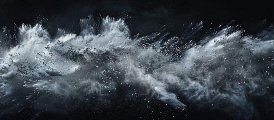 Capture the frozen movement of descending powder against a black backdrop creating an abstract design resembling a dust cloud Ideal as a wallpaper or screen saver with room for additional elements in