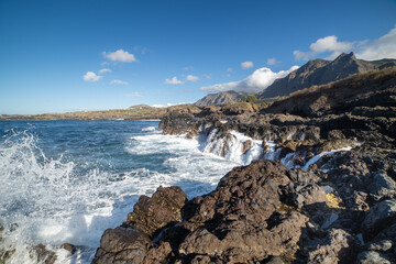Waves beating against the rocks on the coast of Buenavista del Norte. Tenerife. Canary Islands. Spain