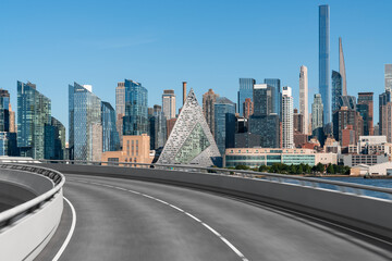 Empty urban asphalt road exterior with city buildings background. New modern highway concrete construction. Concept of way to success. Transportation logistic industry fast delivery. New York. USA.