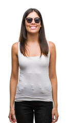 Obraz premium Young beautiful hispanic wearing sunglasses with a happy and cool smile on face. Lucky person.