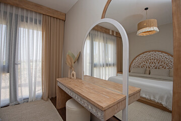 Interior design of bedroom in house with dressing table