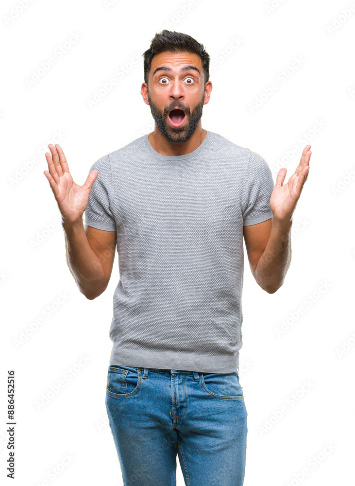 Poster adult hispanic man over isolated background celebrating crazy and amazed for success with arms raise