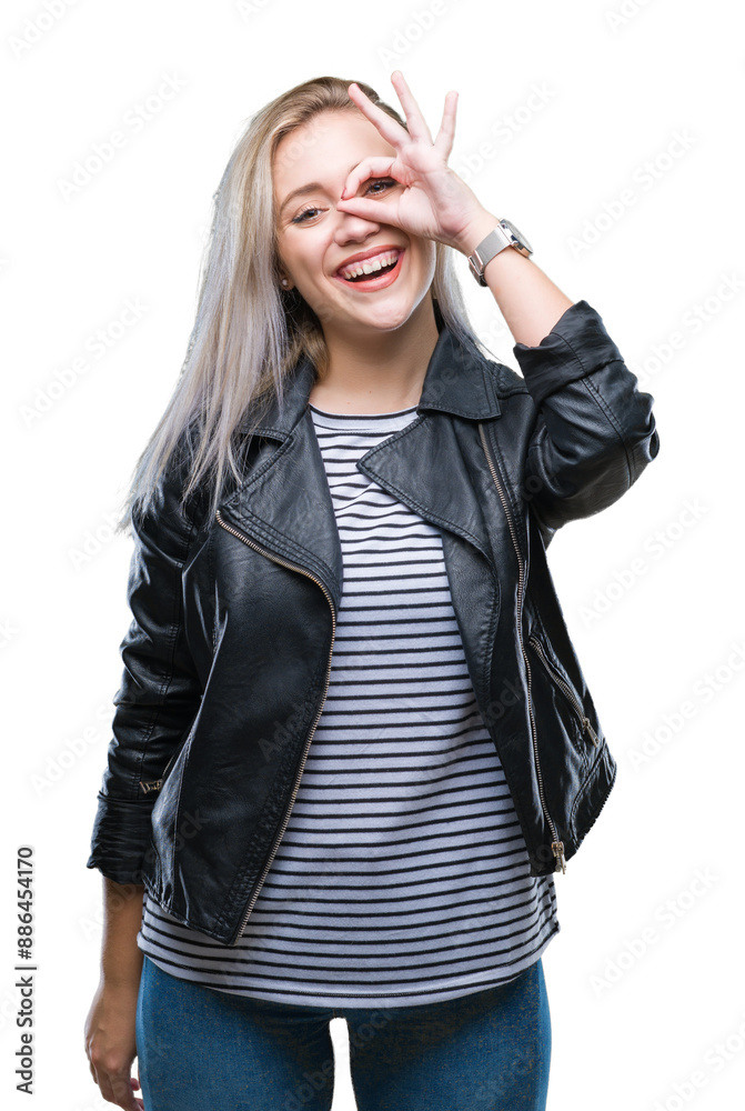 Canvas Prints Young blonde woman wearing fashion jacket over isolated background doing ok gesture with hand smiling, eye looking through fingers with happy face.