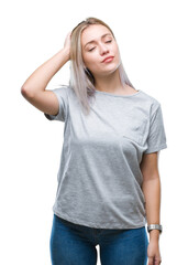 Fototapeta premium Young blonde woman over isolated background confuse and wonder about question. Uncertain with doubt, thinking with hand on head. Pensive concept.