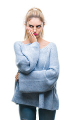 Young beautiful blonde and blue eyes woman wearing winter sweater over isolated background thinking looking tired and bored with depression problems with crossed arms.